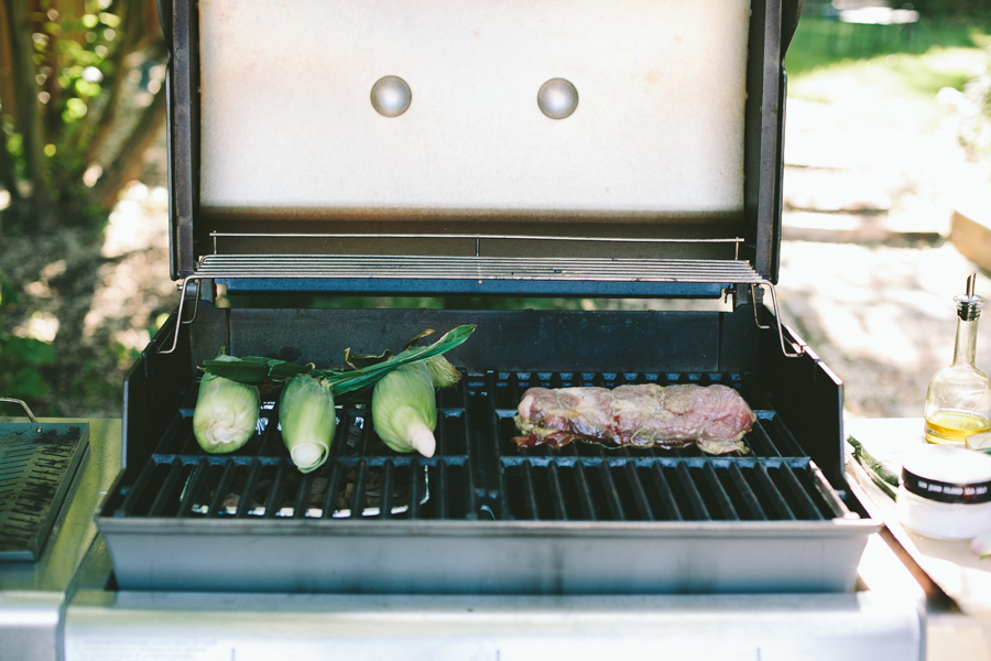 Corn and pork cooking on the grill