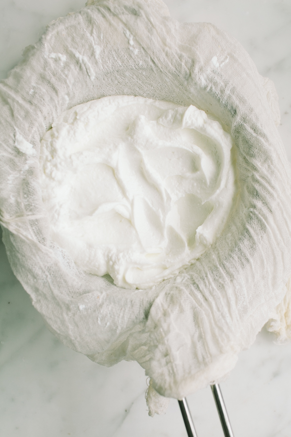 Straining yogurt for labneh