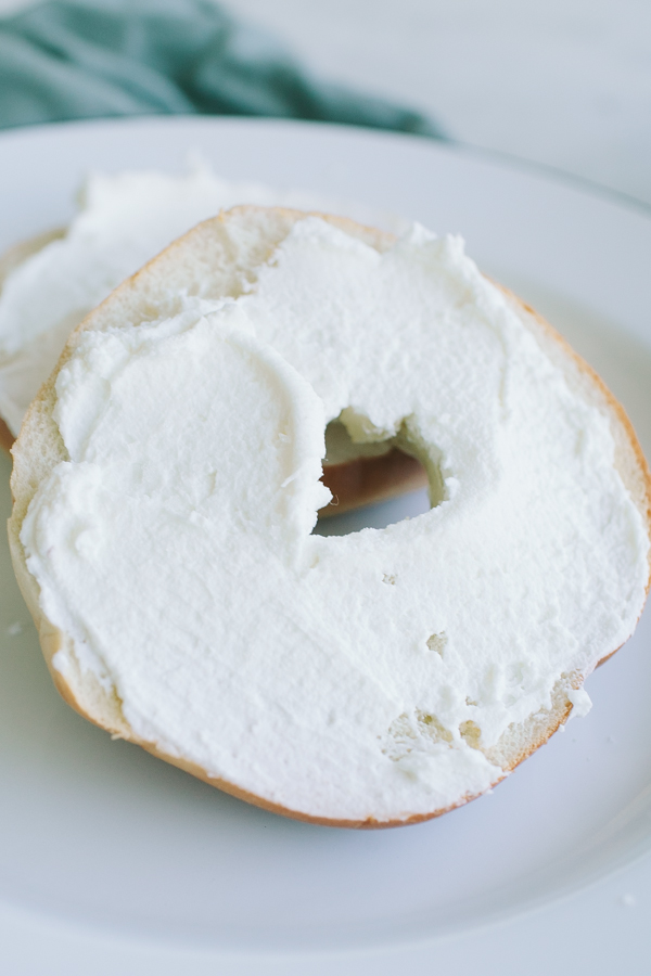Homemade labneh spread on a toasted bagel on Craftsy.com