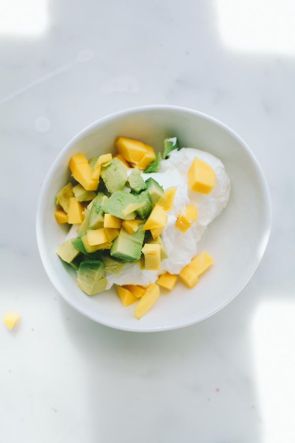 Greek yogurt topped with avocado and mango