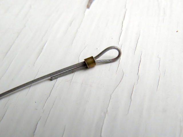 A crimp tube on beading wire, uncrimped