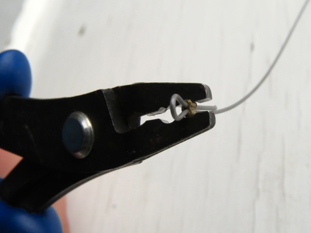A crimp in the front notch of crimping pliers