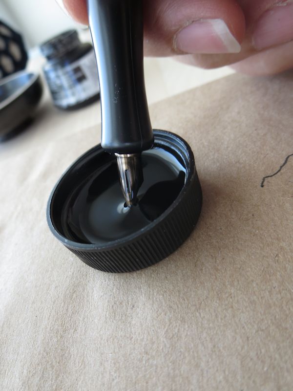 Dipping pen in ink