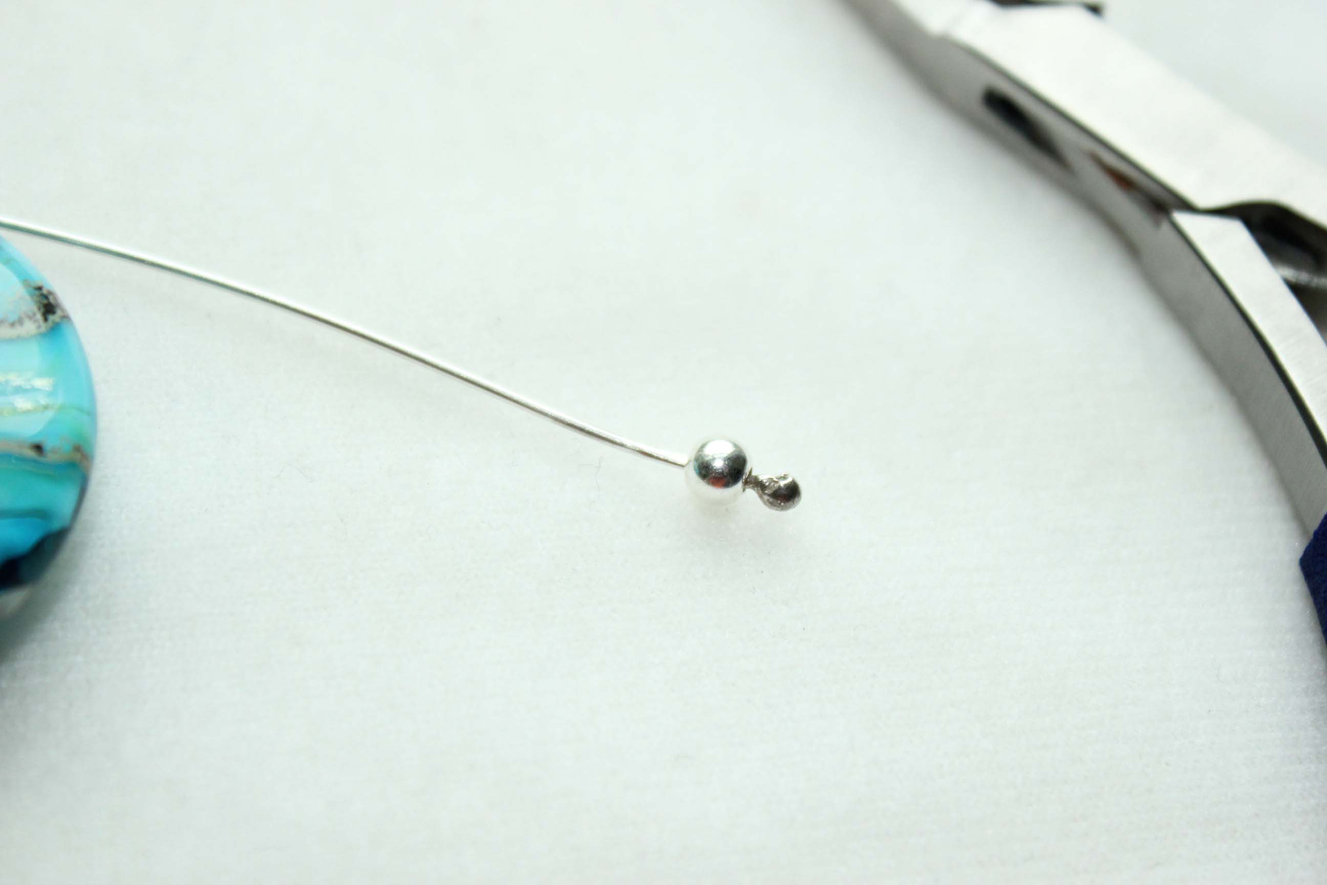 Sterling silver headpin with silver round ball strung on