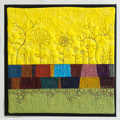 Art Quilt with Stylized Flowers and Pebbles