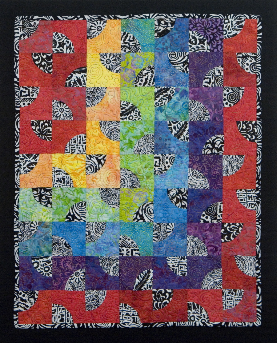 Modern Rainbow Drunkard's Path quilt