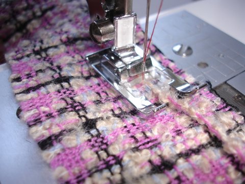 Thread being stitched over the strip 