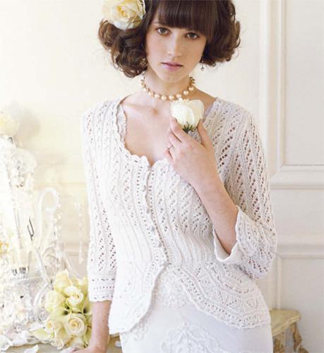 Woman Modeling a White Lace Cardigan - Knitting pattern available on Bluprint.com