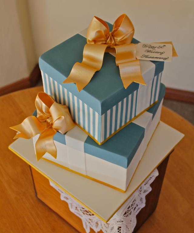 Stacked layers of cake resembling gifts