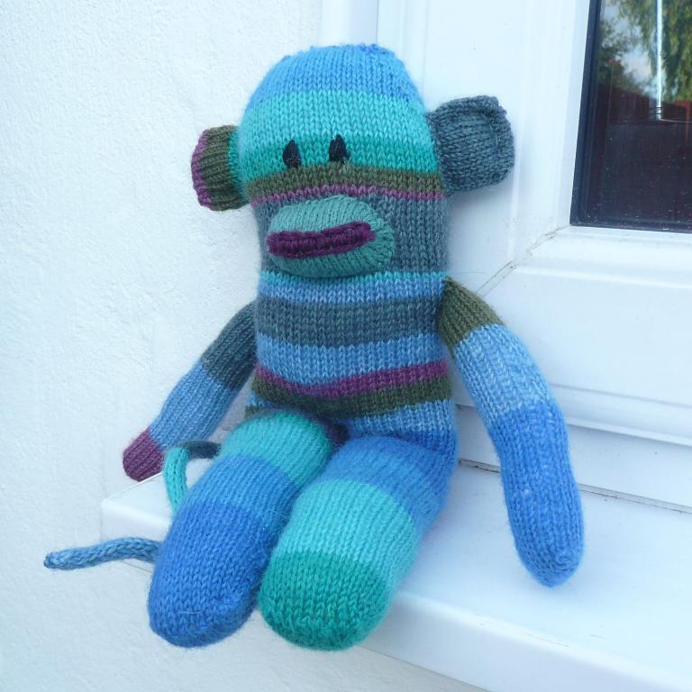 Knitted Sidney the sock monkey doll