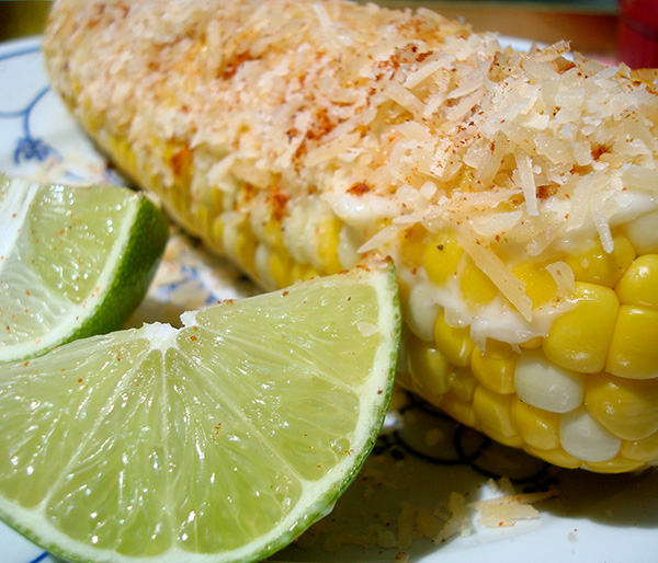 Grilled corn with cheese and lime and chili