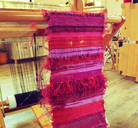 Image of cloth woven with rya knots on a loom