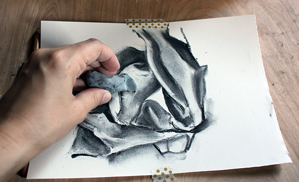 erasing with a kneaded eraser