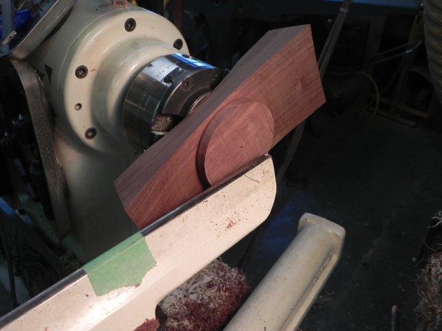 Turning the top surface. Note the blank area for the bowl portion and the tape on the tool rest indicating the "no go zone".