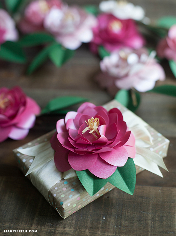 Paper Flowers Embellishing Small Wrapped Packages