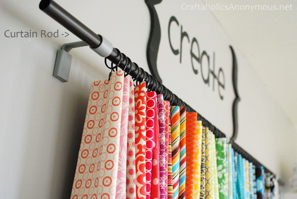 Fabric storage solution using a curtain rod