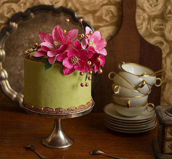 Garden cake with bright pink sugar flowers