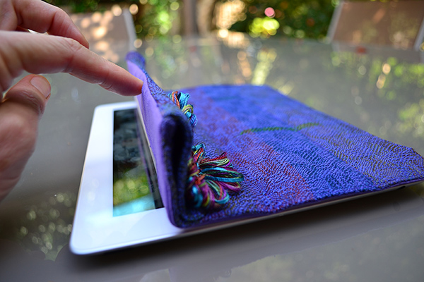 An ipad with a woven cover