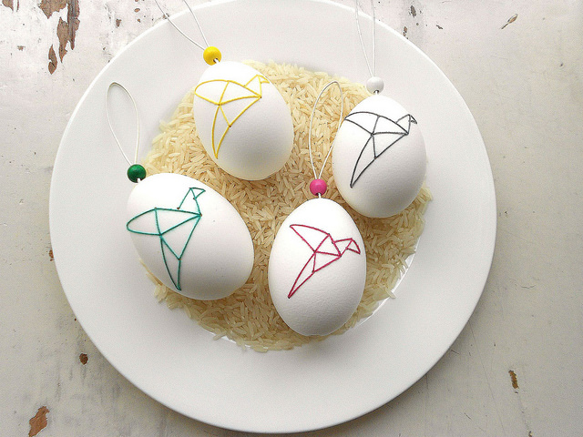 origami style embroidery onto white egg shells