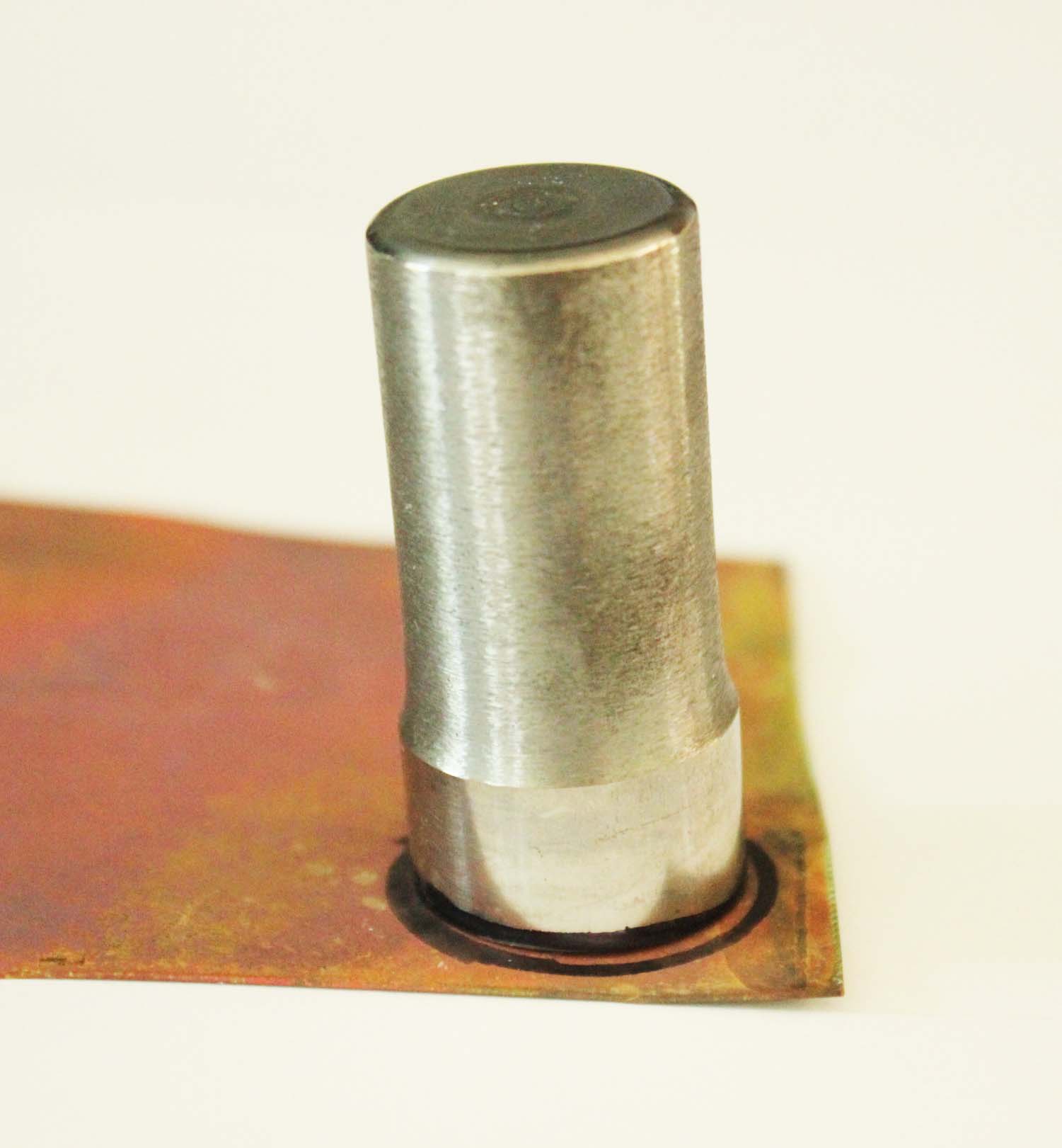 Washers to be cut are shown drawn onto copper sheet