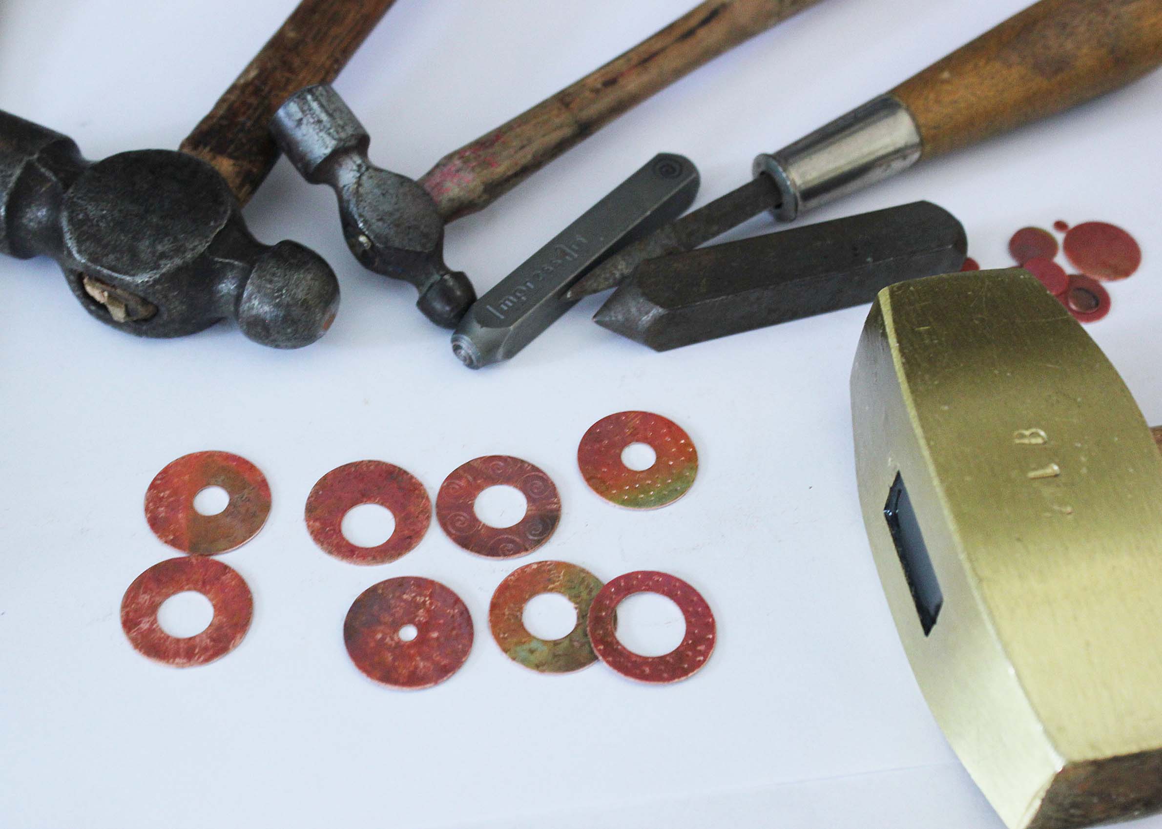 Use tools to add texture to the washers