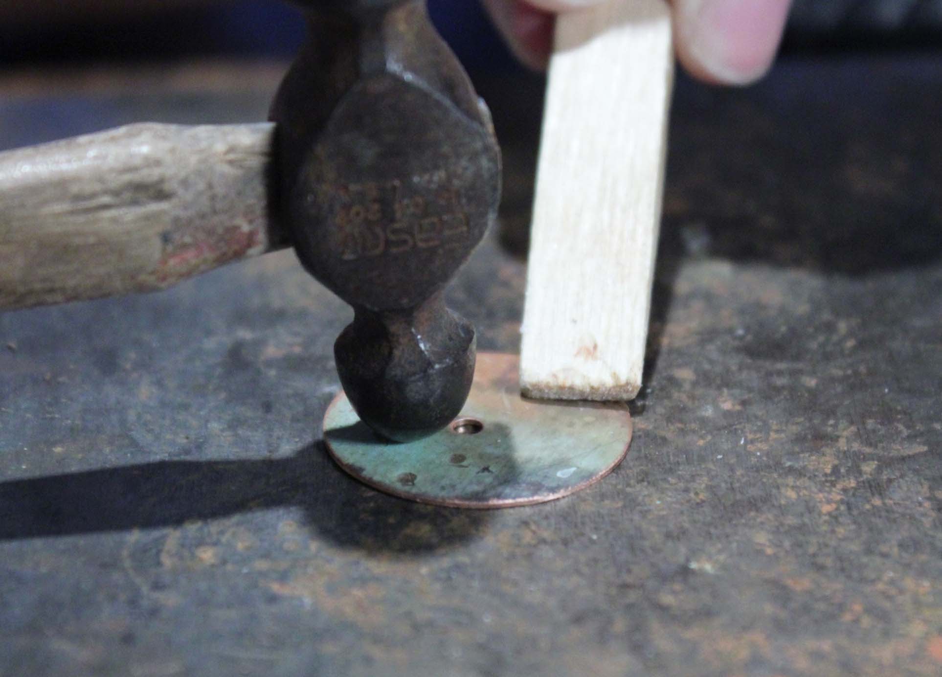 Ball Peen Hammer creating texture on copper disc