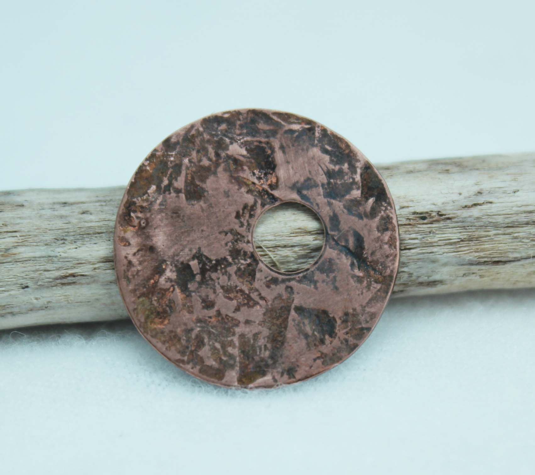 Copper disc textured using a brass hammer