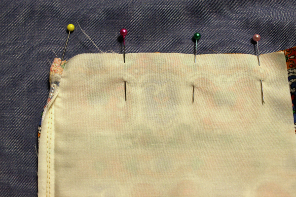lining pinned to garment top edge