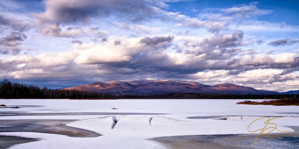 A wide scenic view over Cherry Pond in northern New Hampshire.
