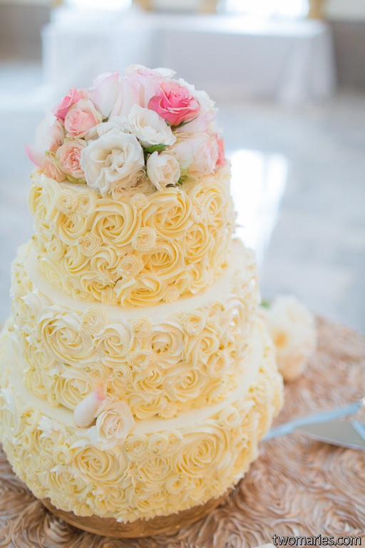 Buttercream rose adorned wedding cake
