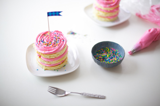 Get ready to dig into a mini cake with pink buttercream frosting