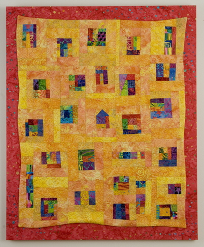 Yellow quilt with splashes of color