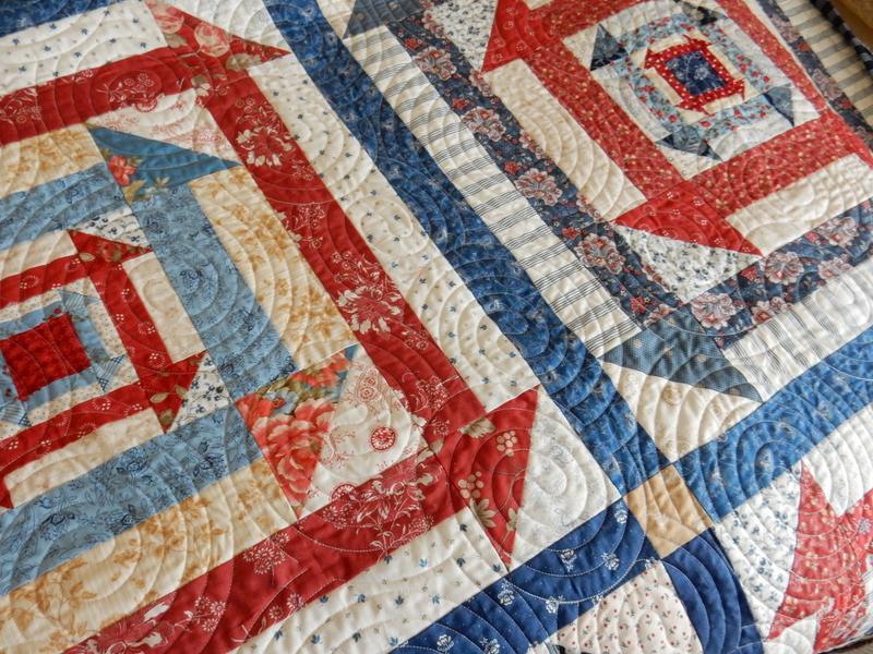 Nested Churn Dash scrap quilt