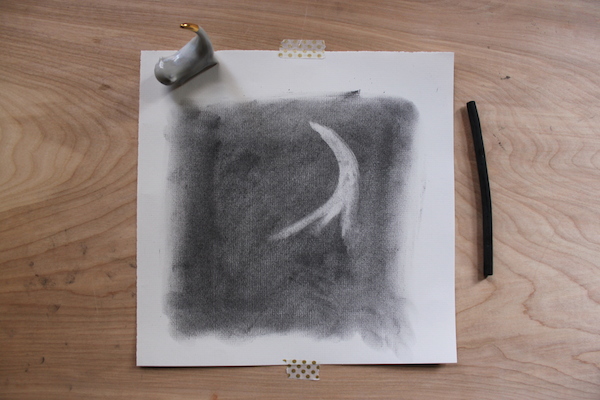 starting to erase forms in charcoal