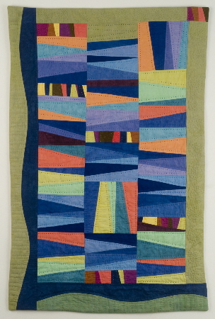 Improvisational stripe quilt in blue and green