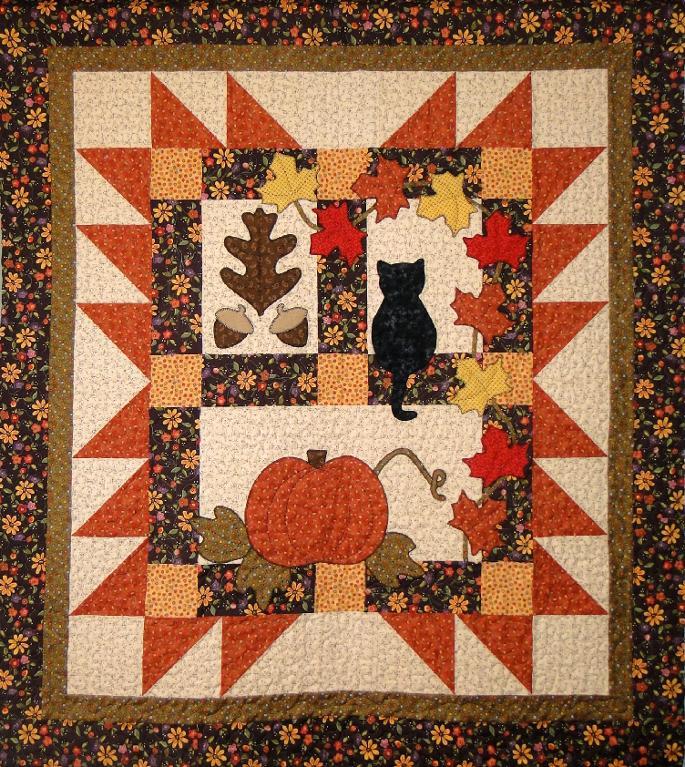 Autumn quilt pattern with pumpkin and cat