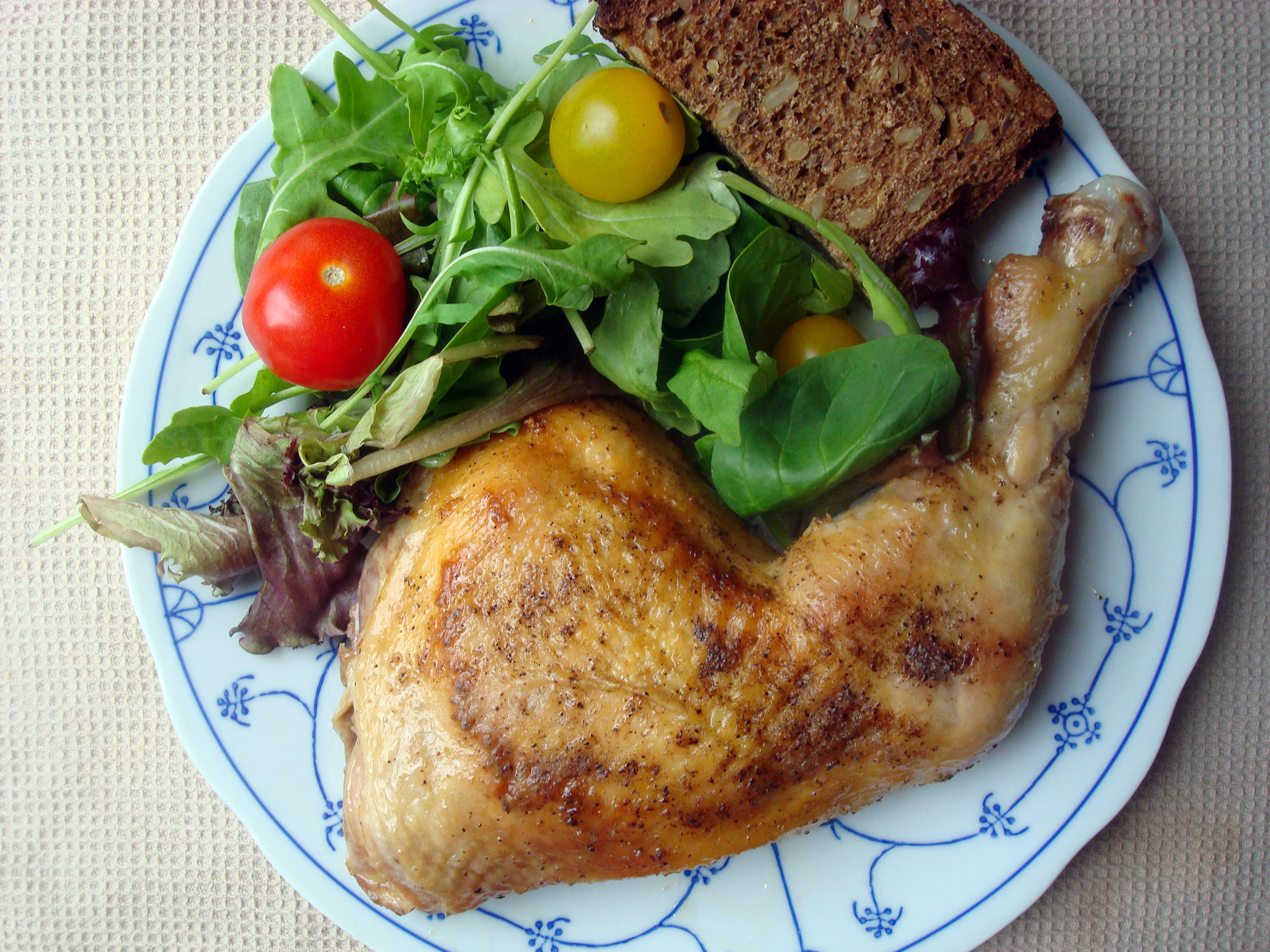 Pan fried chicken leg on plate