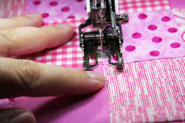 Stitch to the side of the seam allowance
