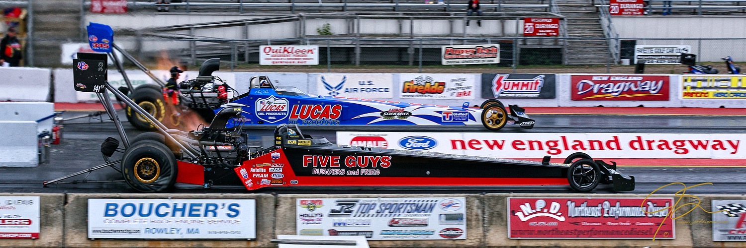 The raw power of a pair of top-fuel dragsters as they leave the starting line