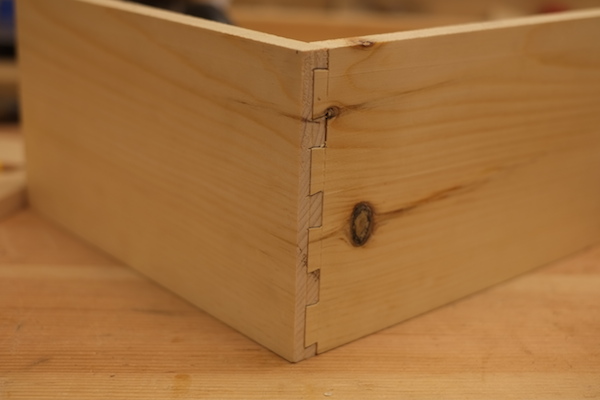 Half-blind dovetail joint hiding a groove