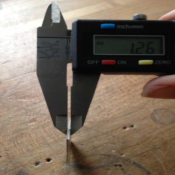 Measure the overall thickness of both of your pieces of metal