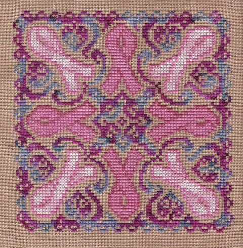 cross stitched mandala pattern featuring pink breast cancer awareness ribbon