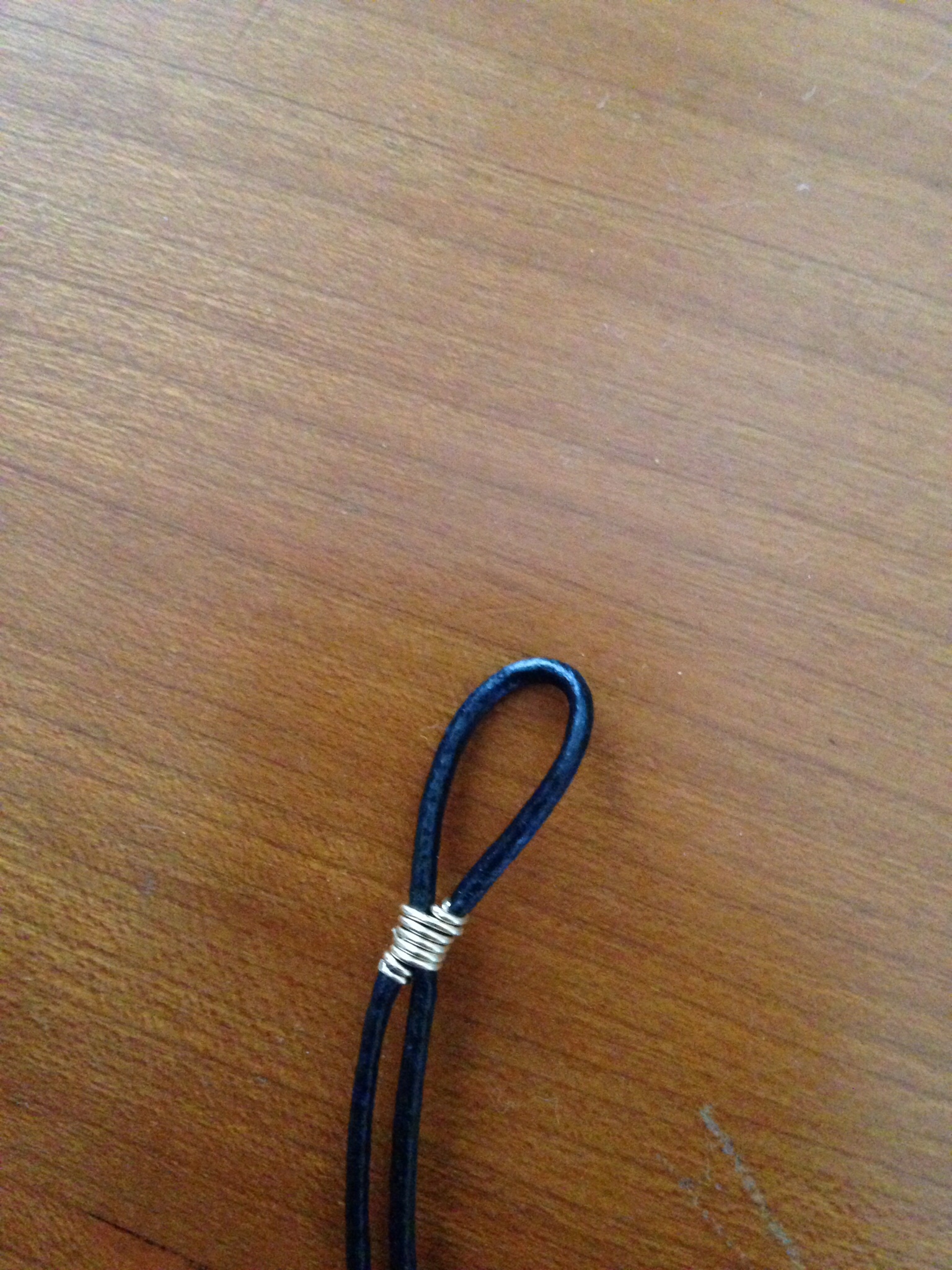 Finsihed leather and wire piece