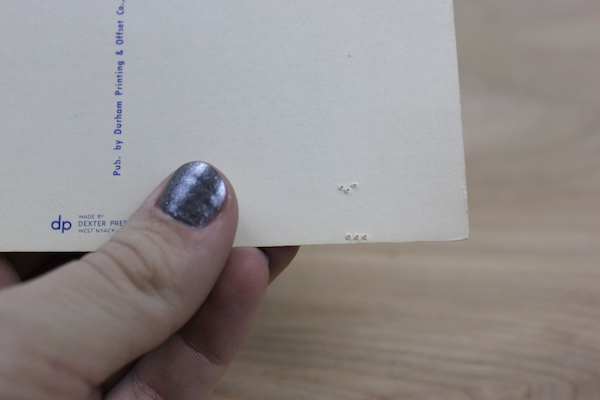 Holes punched in the postcard