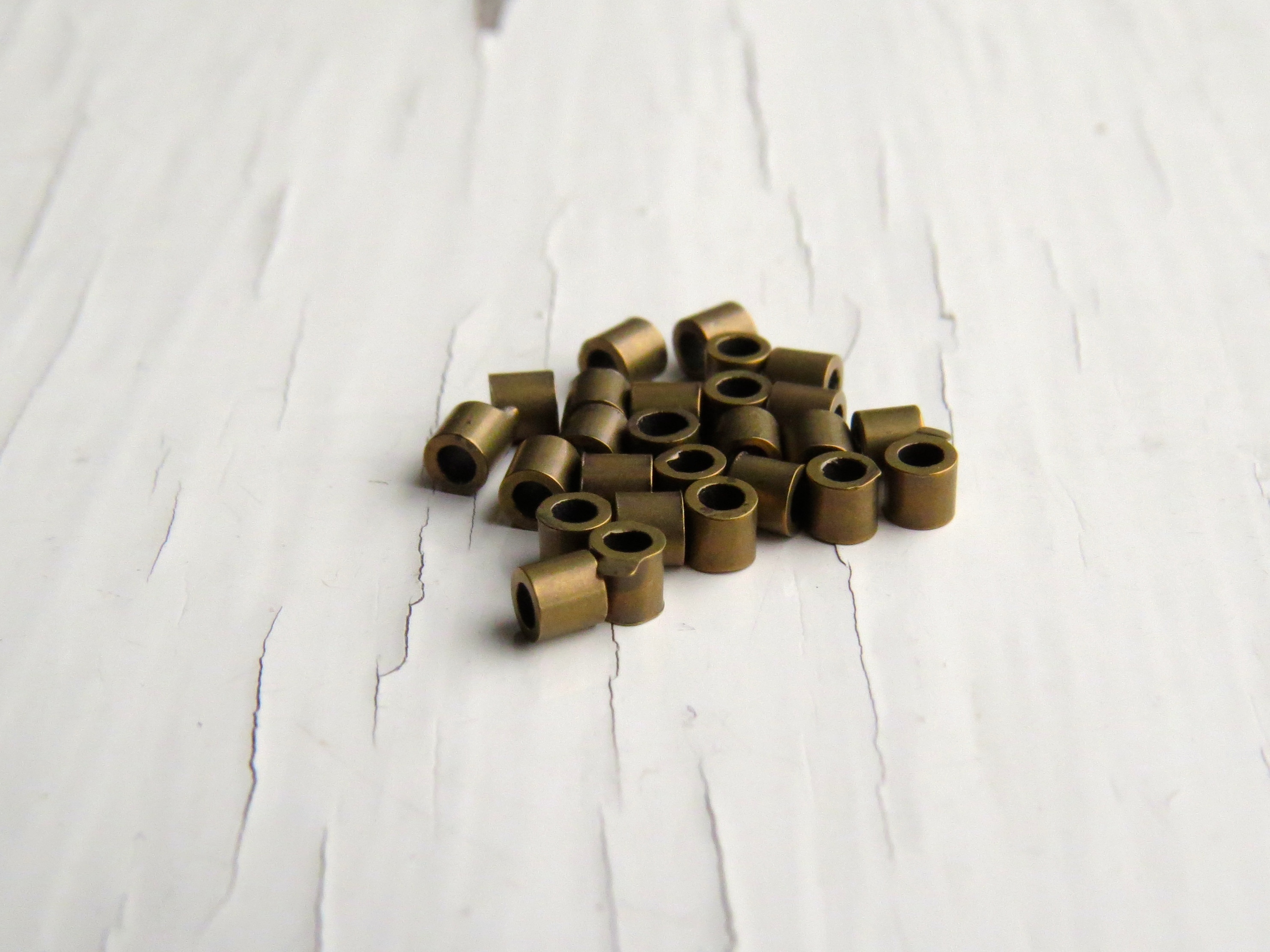 Antiqued brass crimp tubes