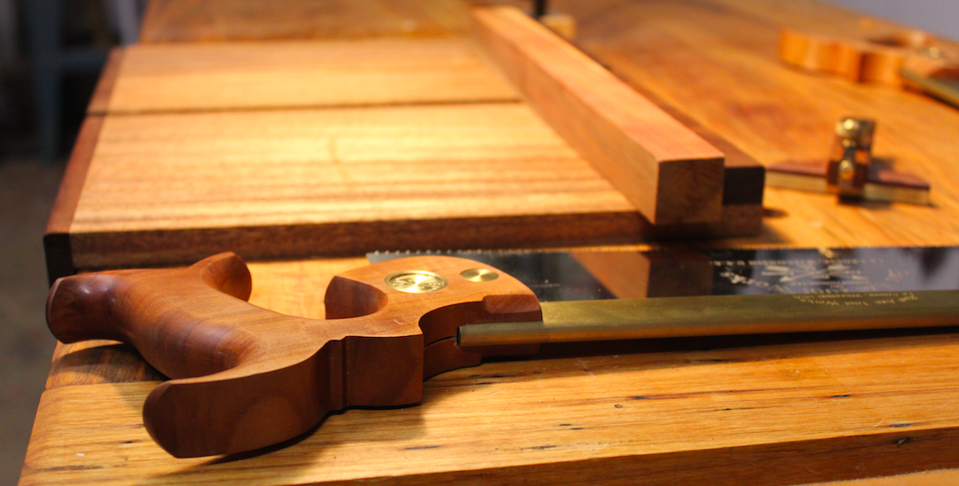 Handsaw is pictured next to a bench hook