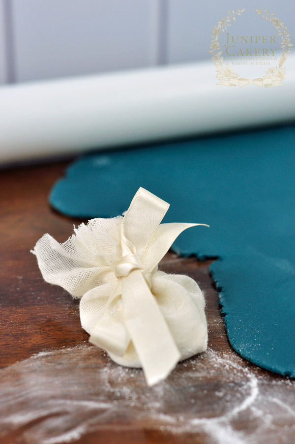 Learn how to cover a cake with fondant