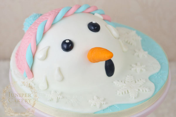 Fun melted snowman cake by Juniper Cakery