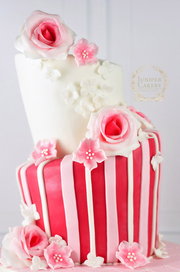 Pink floral topsy turvy cake by Juniper Cakery