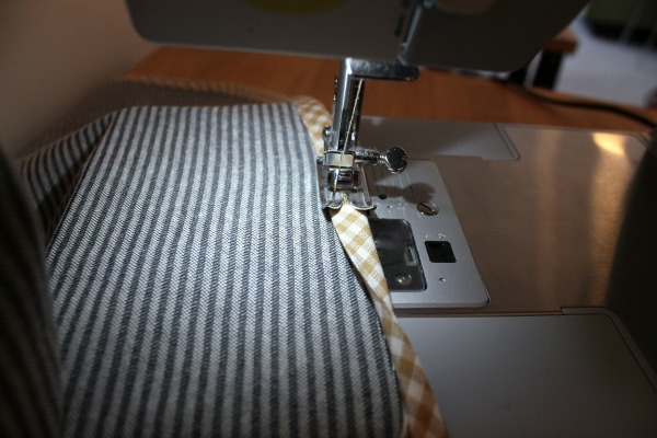 sewing on binding around cover edge